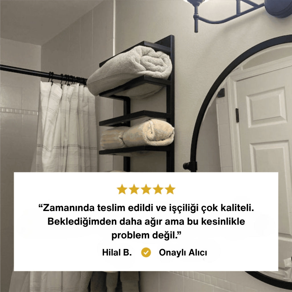 Modern bir banyoda duvara monte edilmiş siyah metal havluluk üzerinde katlanmış havlular bulunuyor. Alt kısımda, beş yıldızlı bir müşteri yorumu yer alıyor: “Zamanında teslim edildi ve işçiliği çok kaliteli. Beklediğimden daha ağır ama bu kesinlikle problem değil.” Yorumun altında “Hilal B. - Onaylı Alıcı” ifadesi bulunuyor.