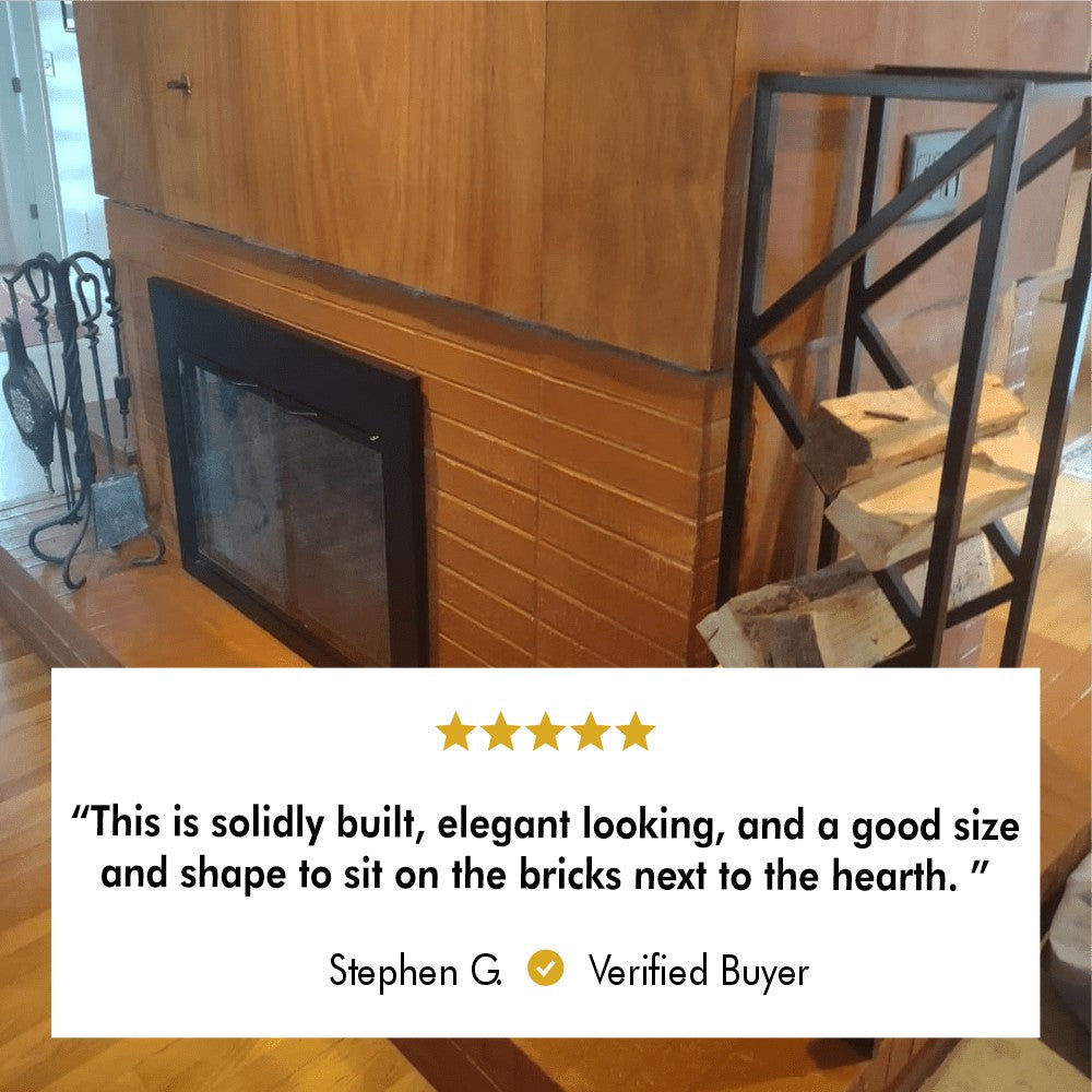 A solidly built metal log rack filled with firewood, placed on bricks near a hearth, described as "elegant looking and well-sized" in a 5-star review.