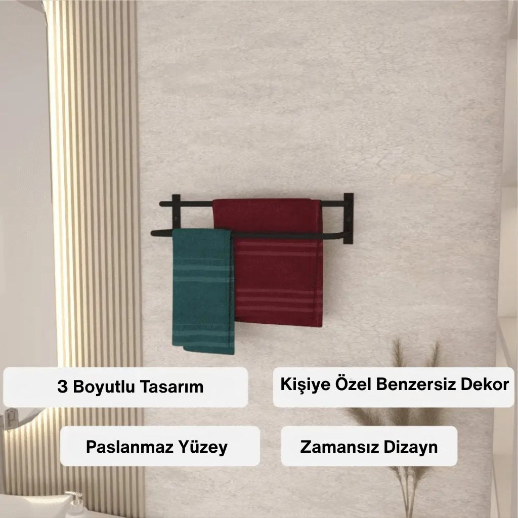 Duvara monte edilmiş siyah metal havluluk üzerine asılmış kırmızı ve mavi havlularla modern bir banyo dekorasyonu görülüyor. Alt kısımda “3 Boyutlu Tasarım”, “Kişiye Özel Benzersiz Dekor”, “Paslanmaz Yüzey” ve “Zamansız Dizayn” gibi ürün özellikleri yer alıyor.