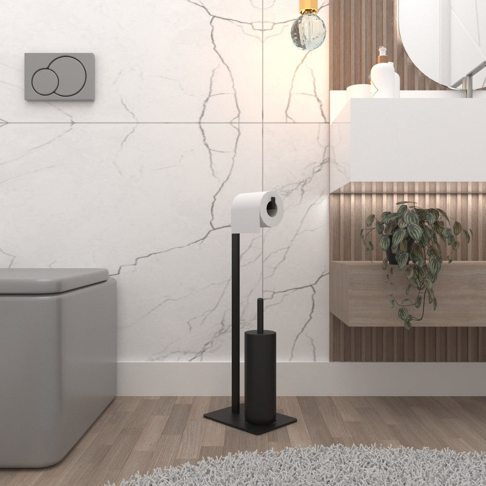 Minimalist bir banyo makyaj masası ve tuvaletin yanına yerleştirilmiş, beyaz mermer bir duvara karşı şık bir tasarıma sahip modern siyah bir tuvalet kağıdı ve fırça standı.